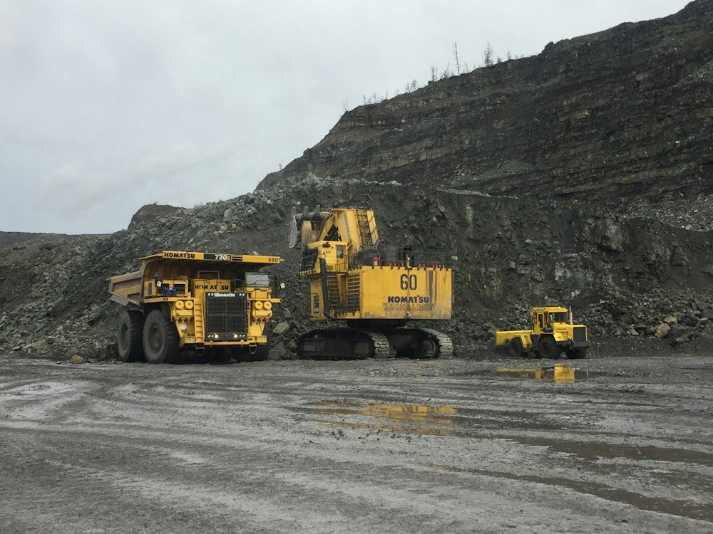 Haul truck and loader at a quarry face