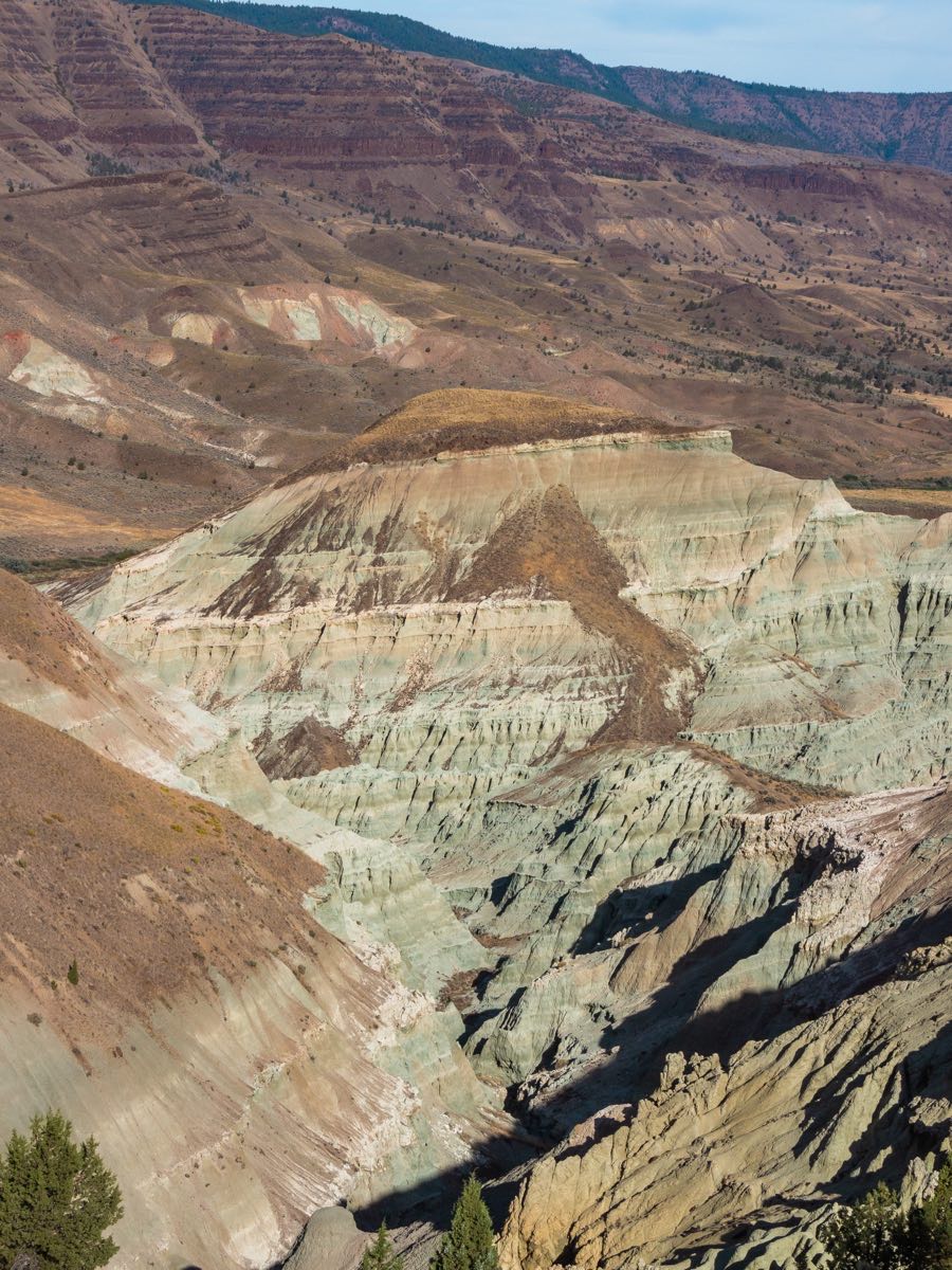 Layered rock formations in a dry valley